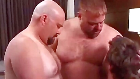 Busty brunette slut is getting fucked by two deepthroats