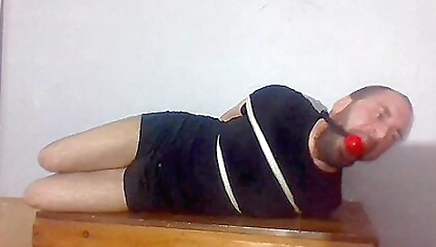 Bondage video shows a guy getting naked and masturbating
