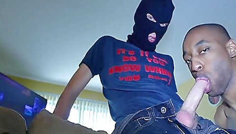 Black mask with a black man with a black uniform on