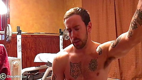 A brunette with a tattooed pussy is in a hot porn video